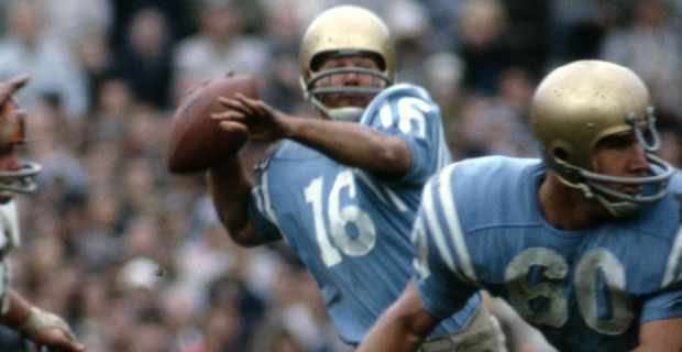 UCLA Bruins quarterback Gary Beban attempts a pass during a college football game.